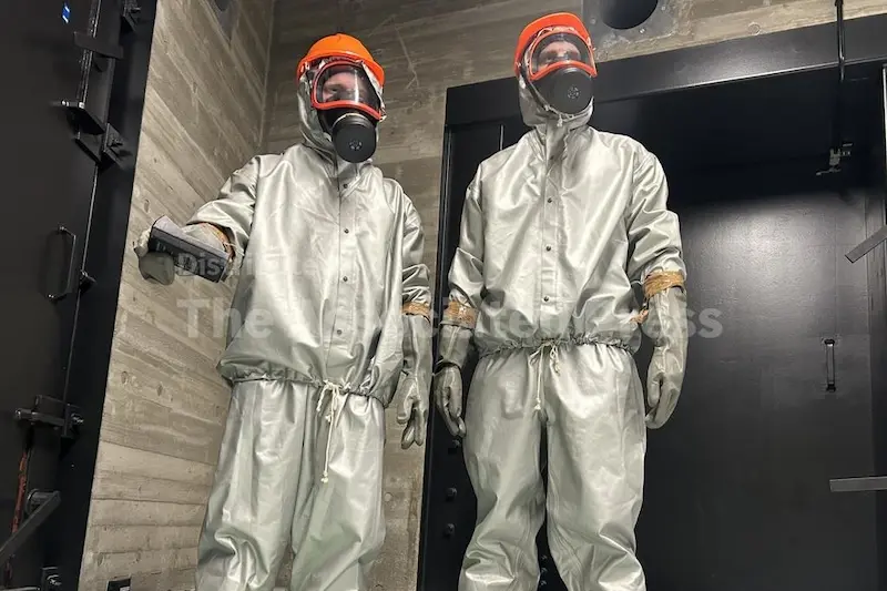 Finnish conscripts measure radiation levels at a shelter in Kuopio, Finland, during a civil defense exercise Wednesday, Sept. 2, 2026. (AP Photo/Emma Burrows)